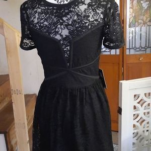 Beautiful black dress with fitted bodice and lace detail